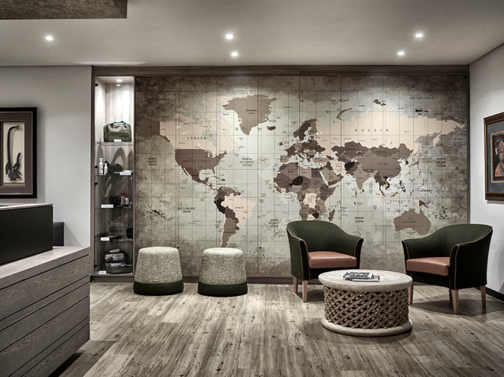 A commercial space with a map and seating area for the foyer
